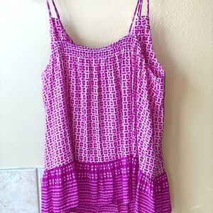 Flowy printed top. Double straps. Hits at hips.